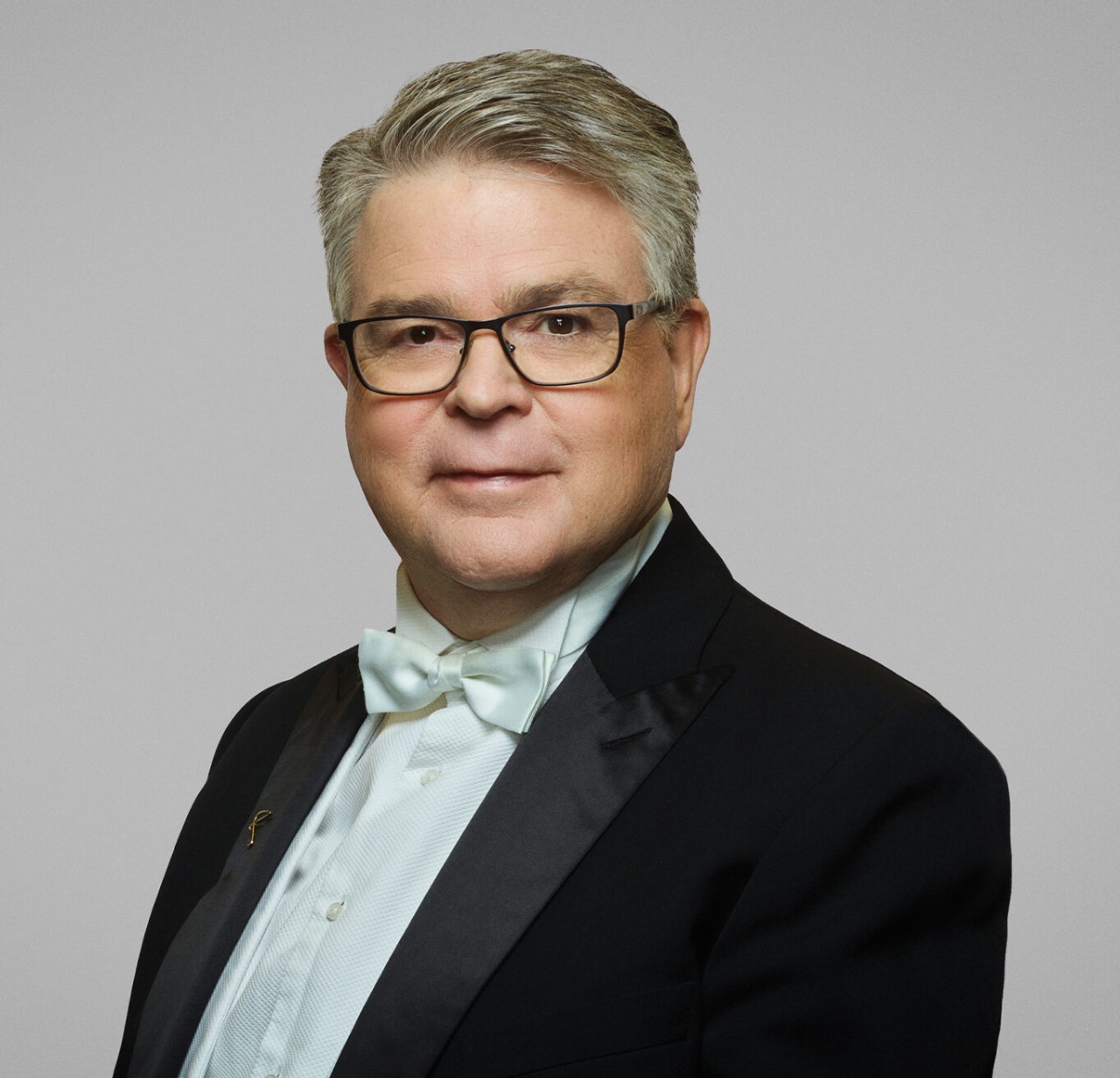photo of a man looking at the camera