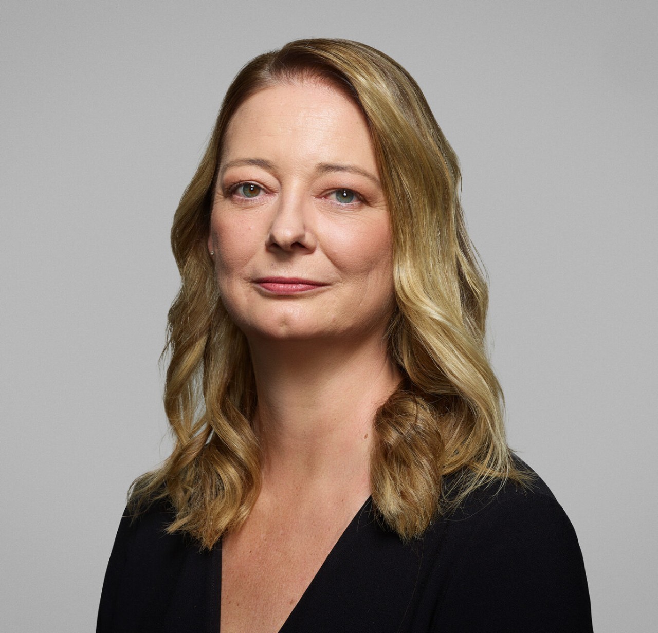 photo of woman smiling at camera