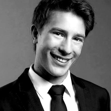 photo of a young man smiling at the camera