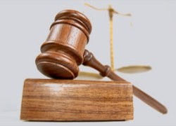 Wood gavel on a white table. 