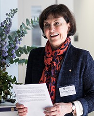 Professor Susan Pond providing a welcome outside the John Makepeace Bennett meeting room
