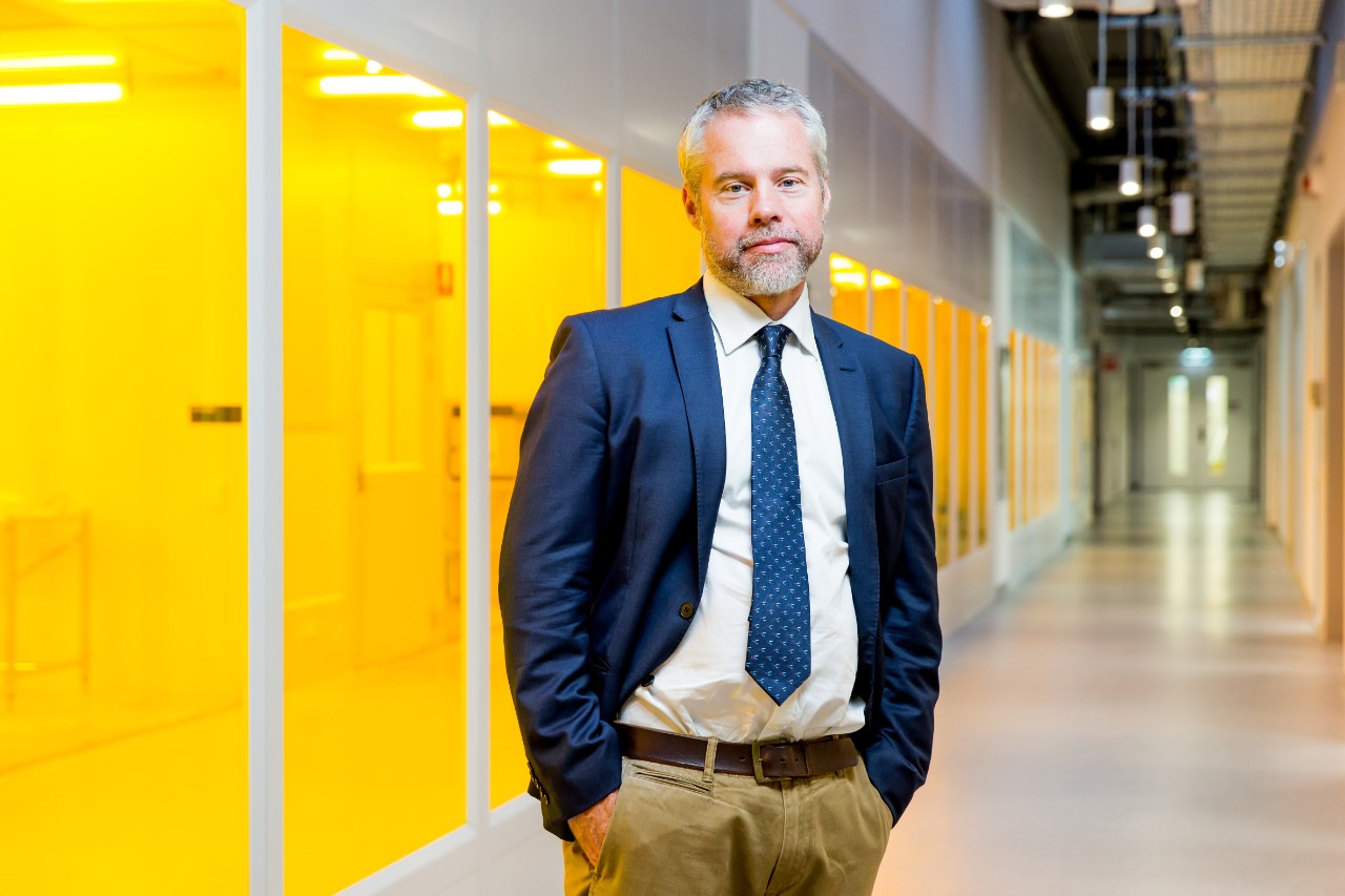 Professor Benjamin Eggleton beside the cleanroom in the Sydney Nanoscience Hub which houses his new laboratories.