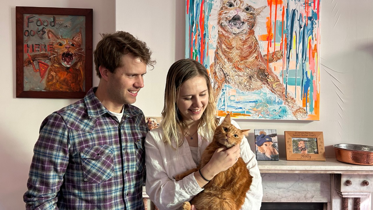 Collin and Daria Anderson with Phineas and some of the art he has inspired.