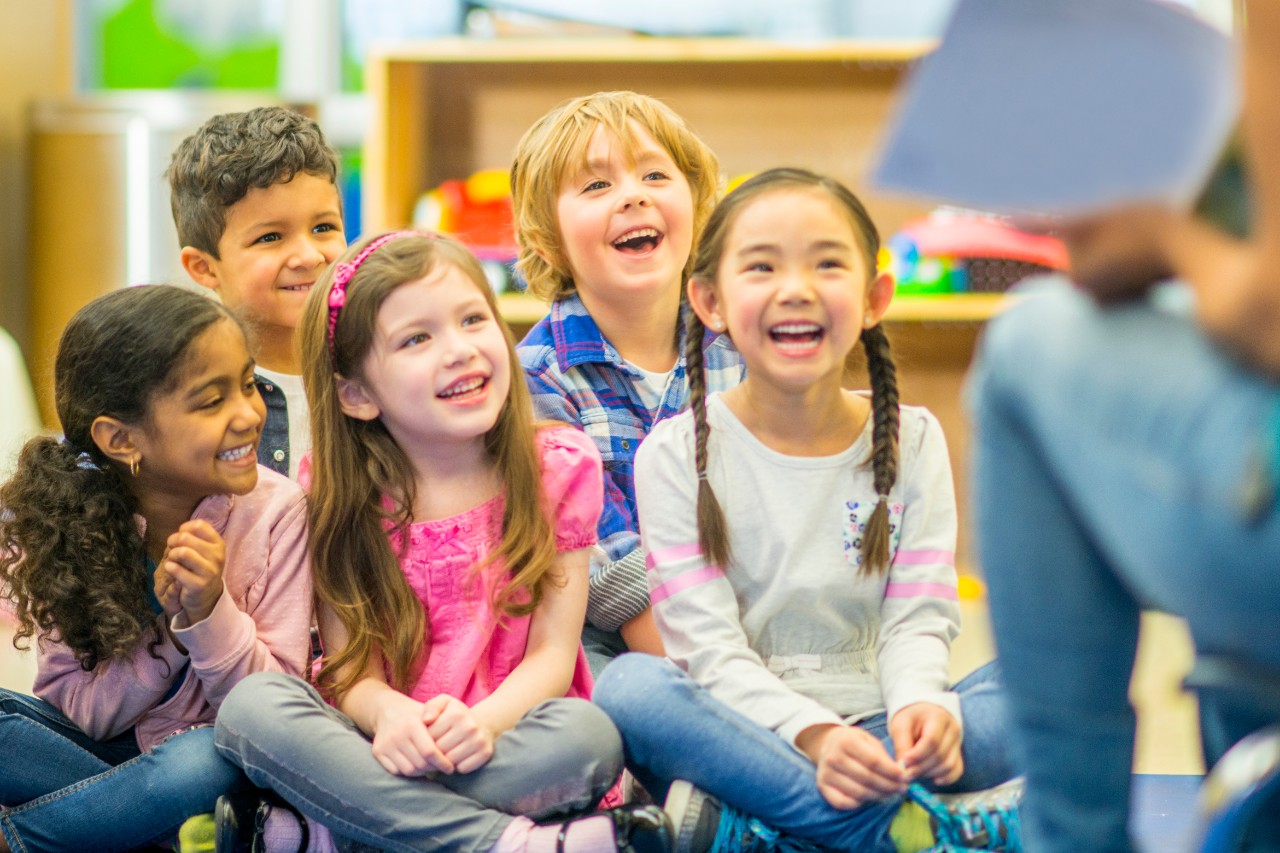 Children in a classroom listening to a teacher. Image: iStock