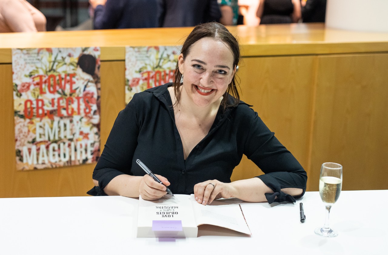 Emily Maguire signing books