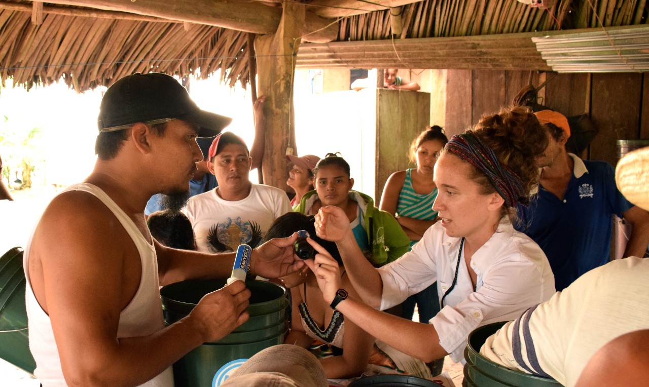 Captain Sophie Hollingsworth teaches the local community about safe water as part of AquaAid International.