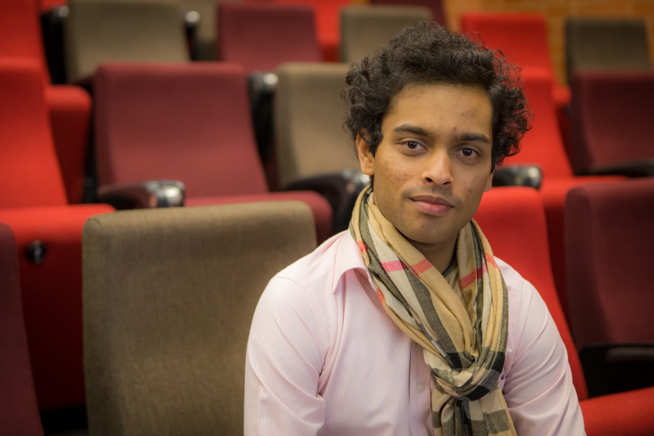 Asanka Wijetunga sitting in a lecture theatre