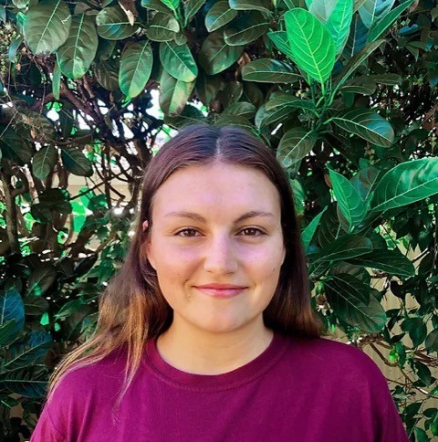 photo of svetlana sterlin, a young woman in a red t-shirt smiling at the camera