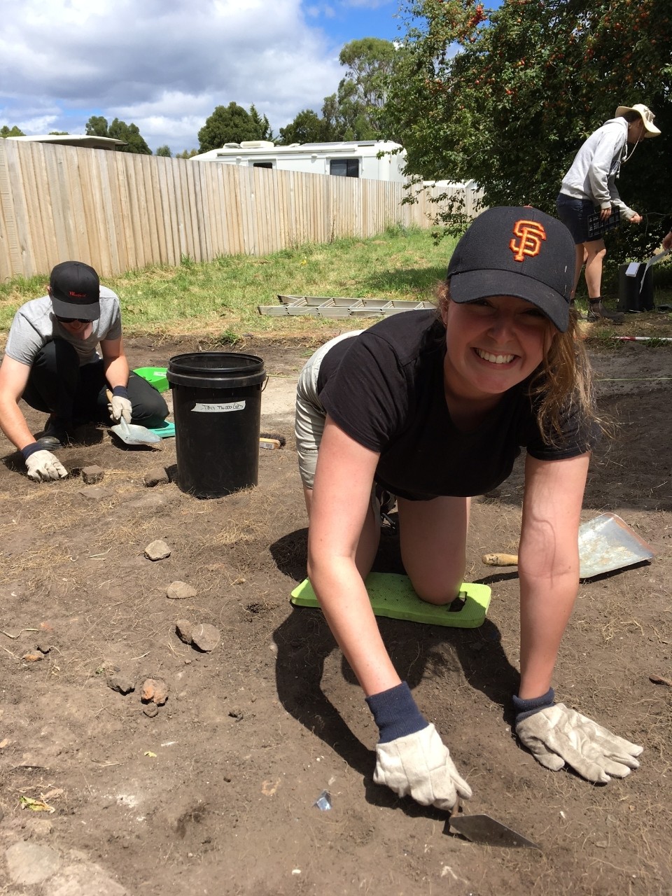 Bachelor of Arts student Grace Kane trowels at Triabunna. Image: University of Sydney