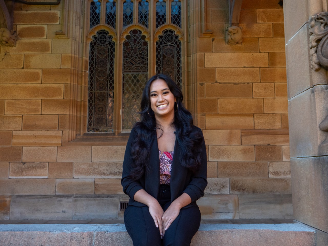 Kintan smiles at the quadrangle, the University of Sydney