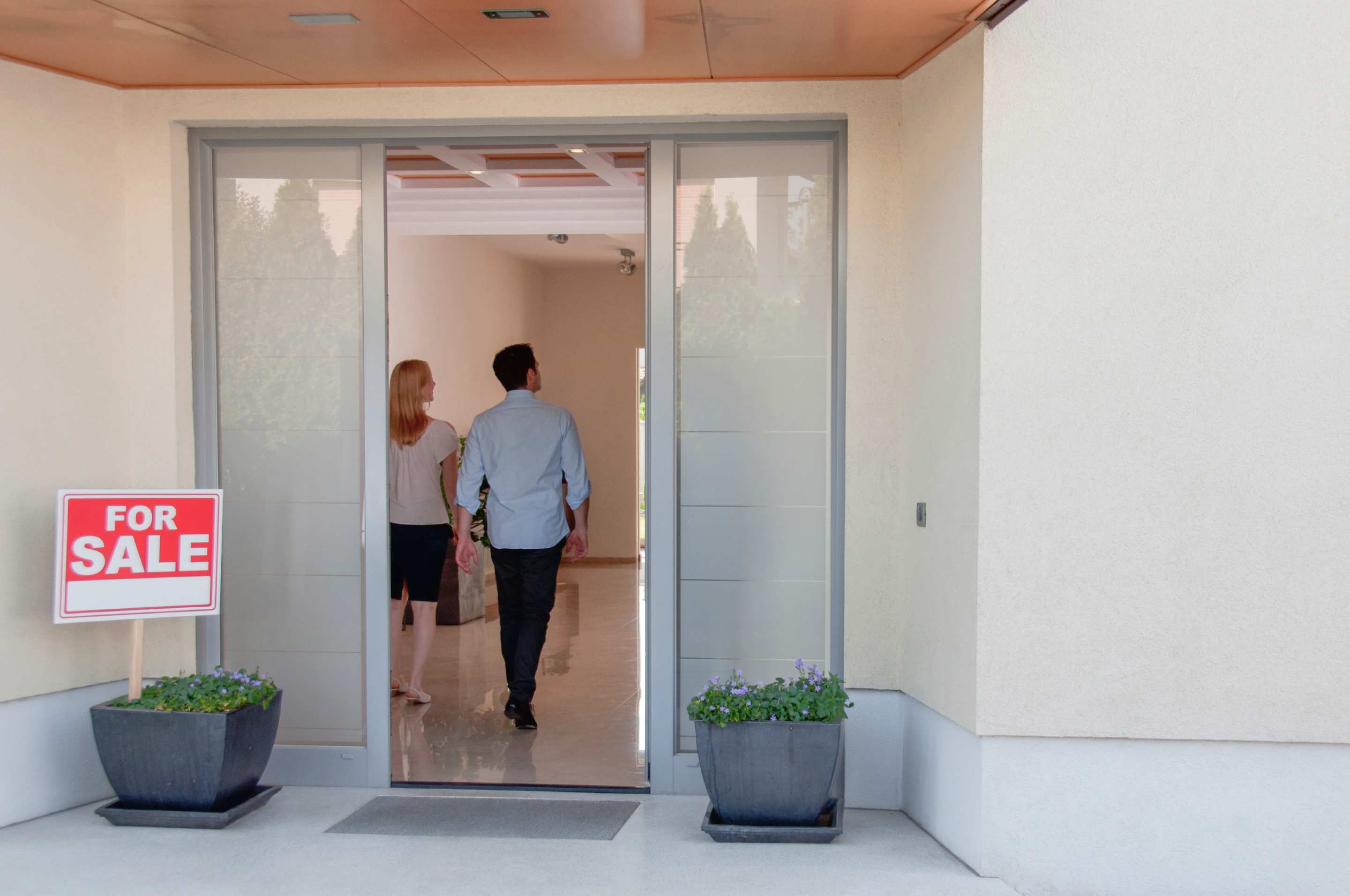 A young couple view enter a property for sale. Image: iStock