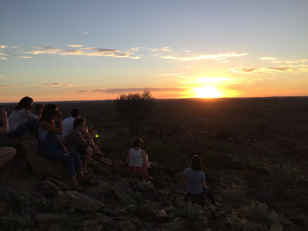 Students watching a sunset