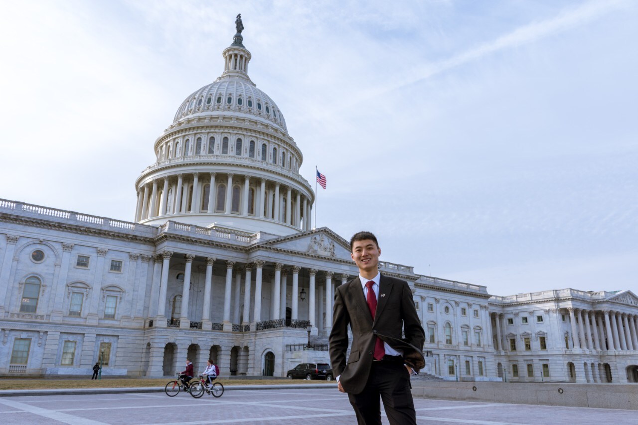 Dane Luo in front of the United States Capitol building