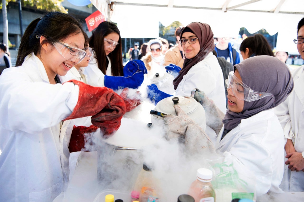 Students taking part in a campus activity using liquid nitrogen