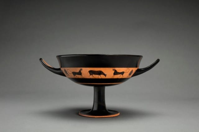 A black figure kylix or drinking cup