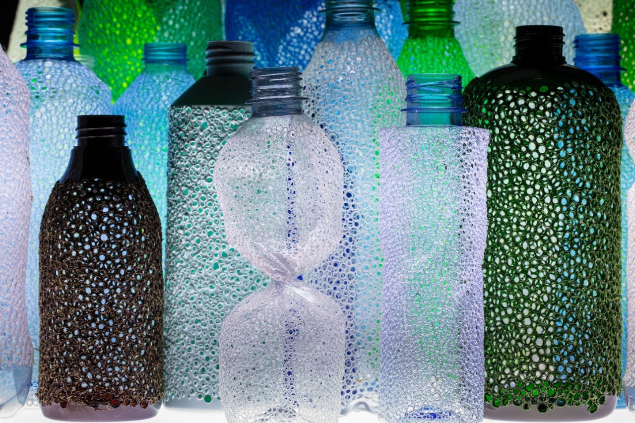 Sarah Goffman, Perforated bottles A.D., 2021, PET, acrylic paint, LED lightbox.