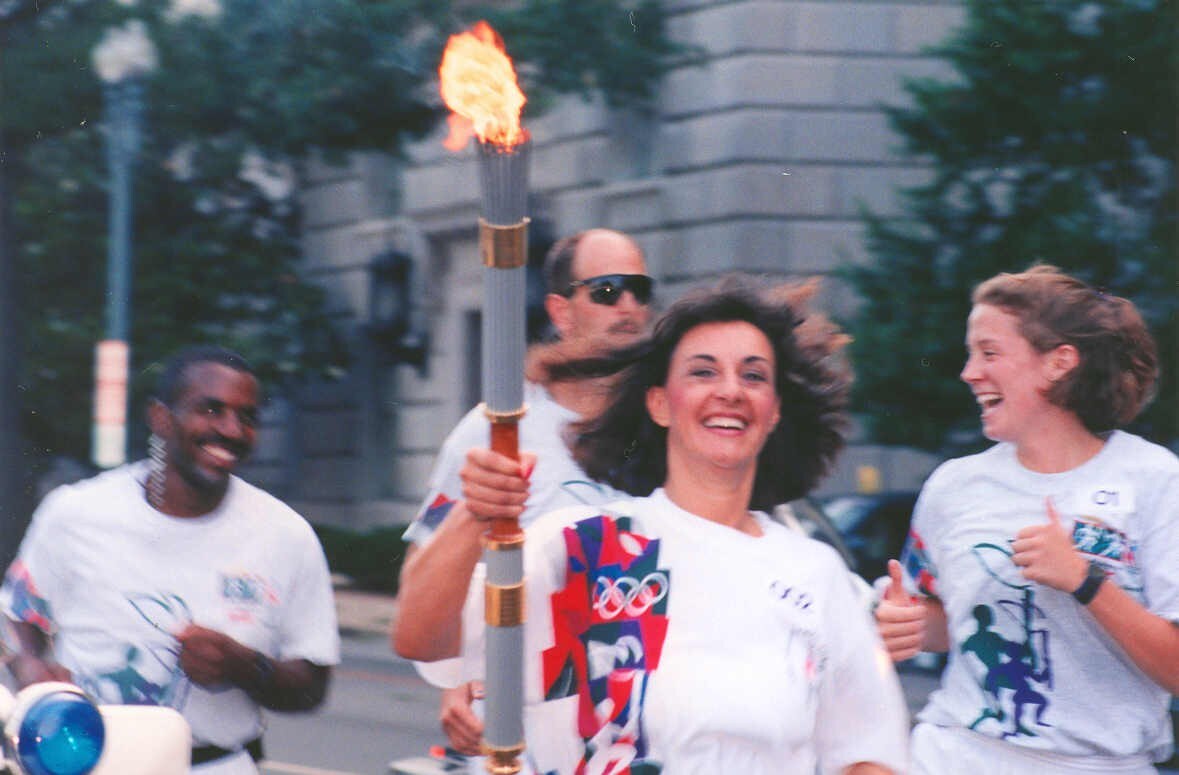 Woman carrying Olympic torch