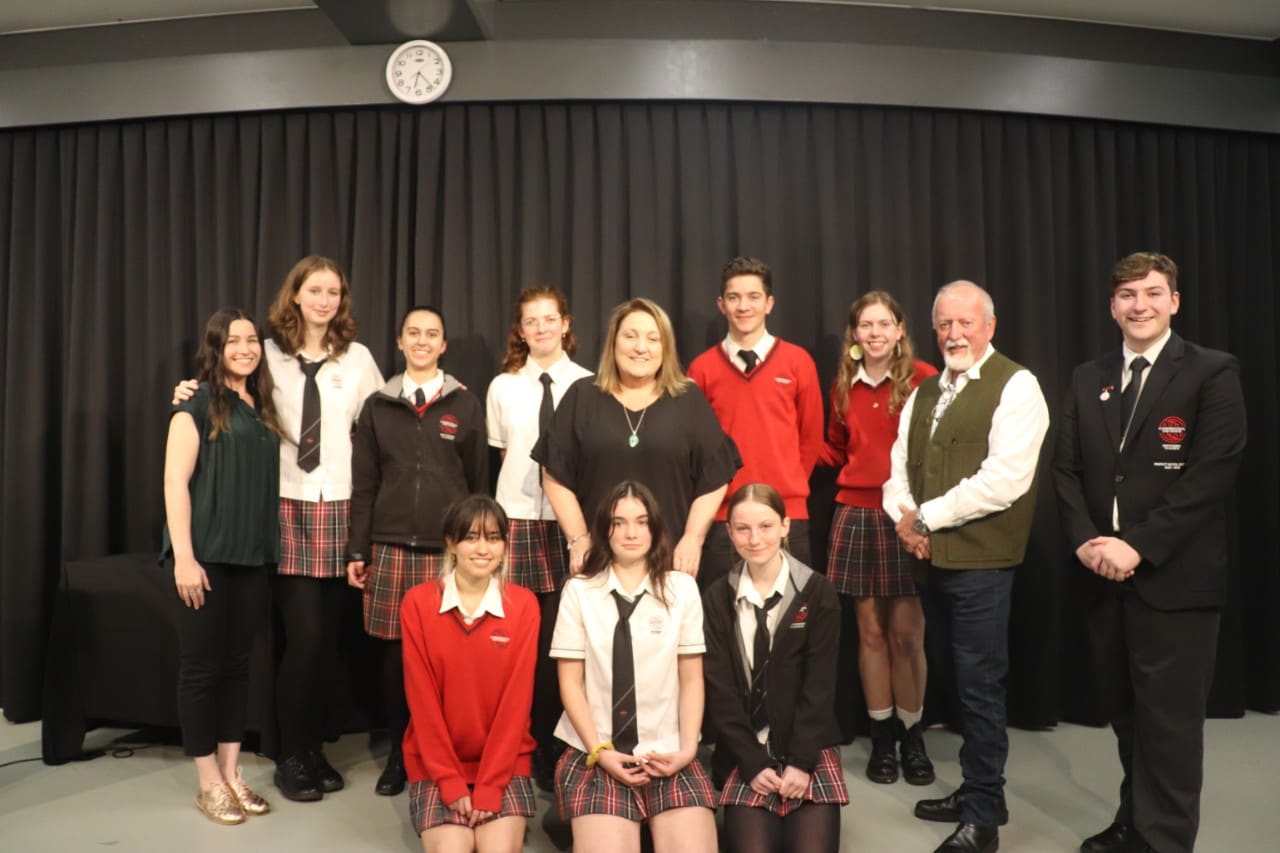 Image: Professor Dennis Foley, teacher Ms Jessy Coulson, and Ms Irene Wardle with the class of Year 12 Aboriginal Studies, taken at the Major Project Exhibition, Cammeraygal High School