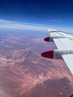 Wing of an aeroplane flying over remote Australia