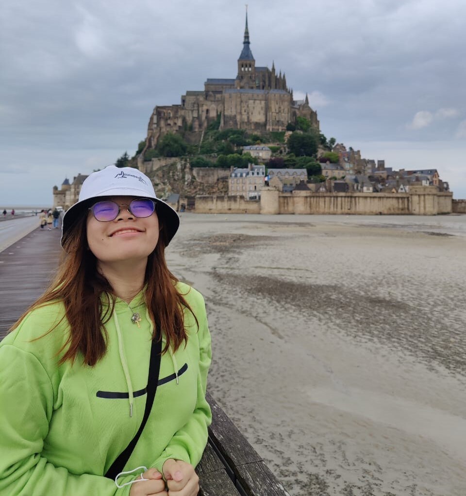 Huay Yee in front of Mont Saint Michel in Normandy France
