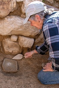 A Pella Volunteer working at the site in 2019.