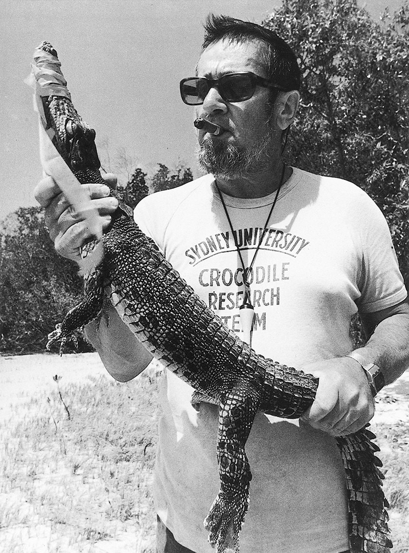 Harry Messel holding a baby crocodile