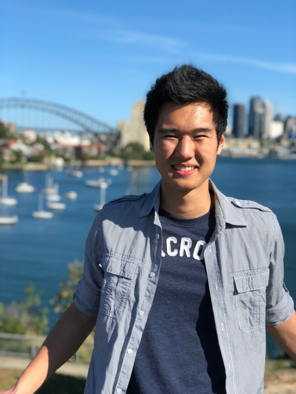 Student Jett Ho with Sydney Harbour in the background