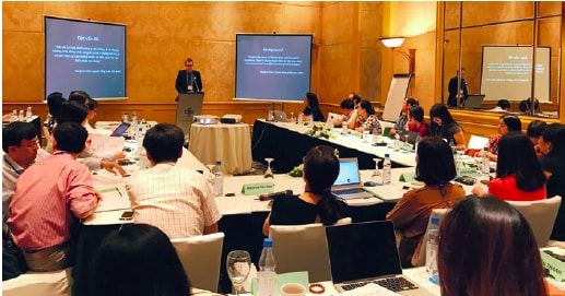 Associate Professor Greg Fox attends a meeting in Hanoi in 2018 for the VRESIST study.