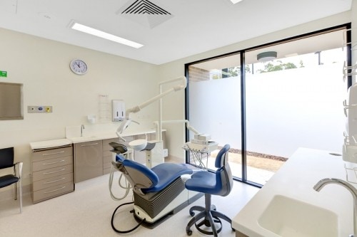 Dental room with empty dentist chair 