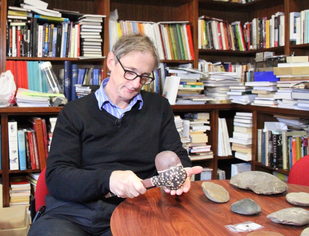 Professor Peter Hiscock with a hafted axe, indicative of the kind the fragment came from.
