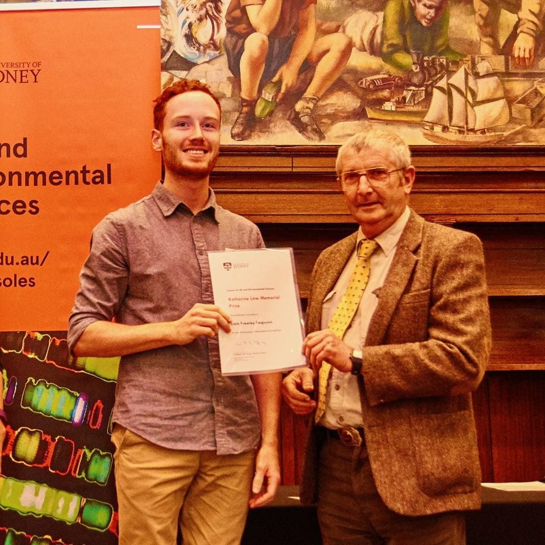 Liam Ferguson receiving a prize in microbiology