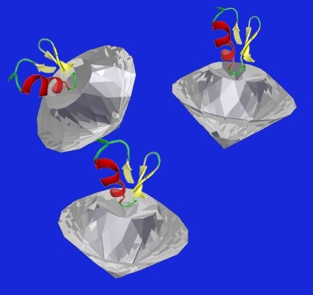Artist impression of nanodiamonds attached to cancer-targeting molecules. The nanodiamonds act as lighthouses in an MRI, lighting up cancers that bind to the chemicals on their surfaces