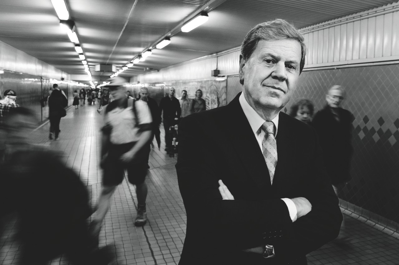 black and white image of ray martin in the underground tunnel at sydney's central station