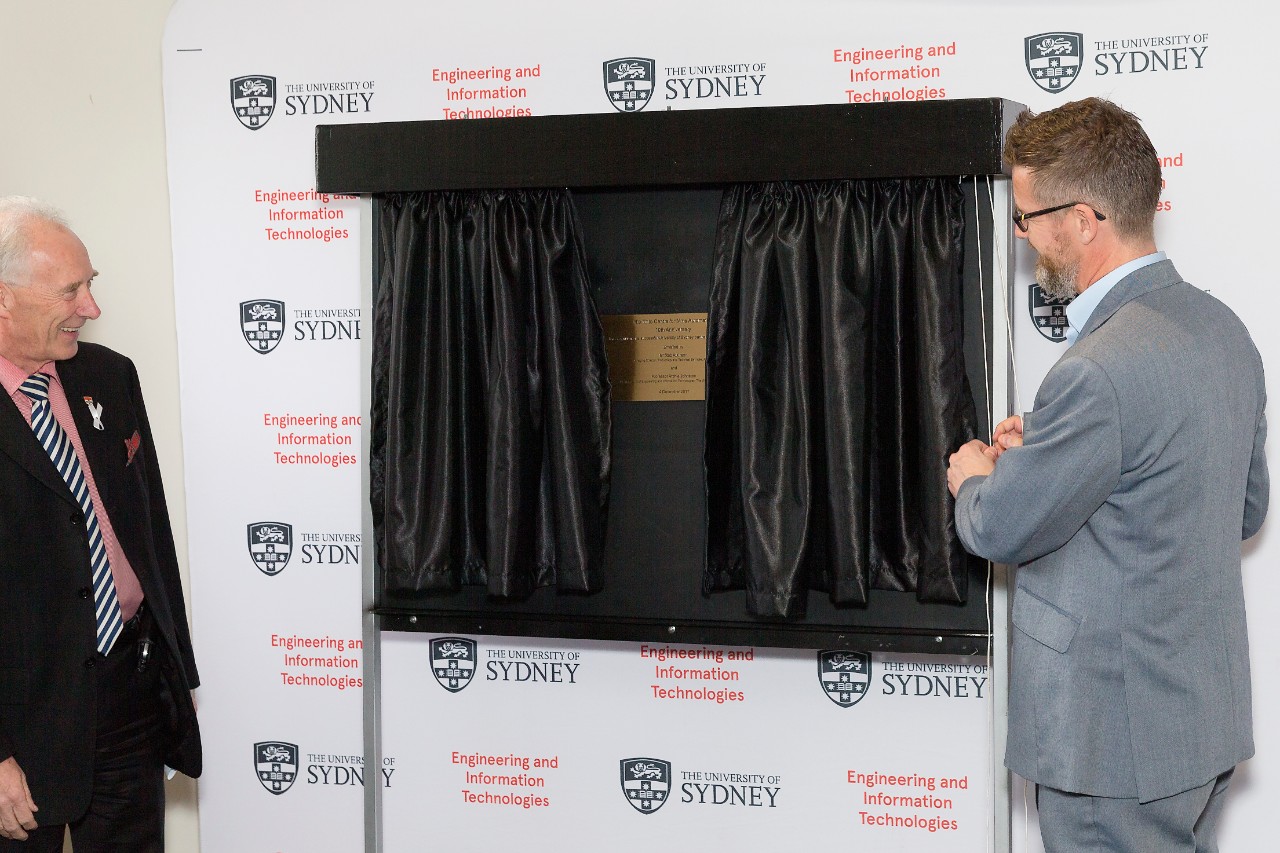 Professor Archie Johnston and Rob Atkinson unveil the commemorative plaque. 