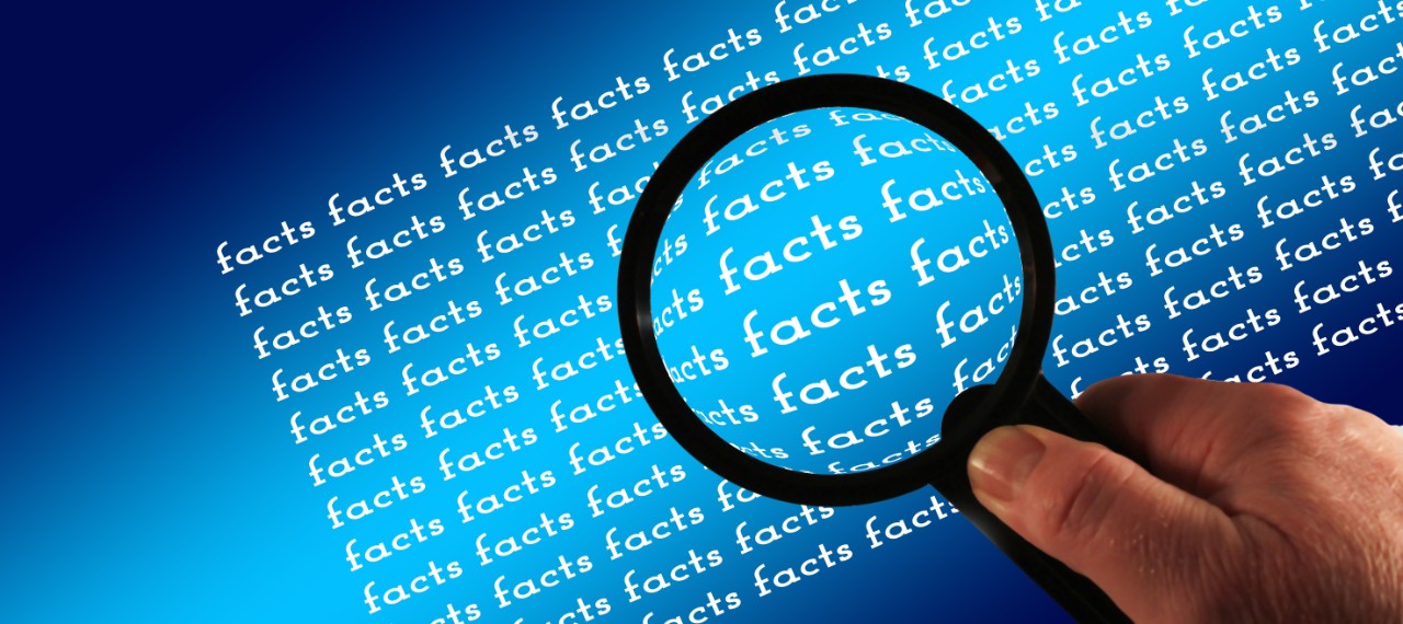 Magnifying glass illuminates the facts