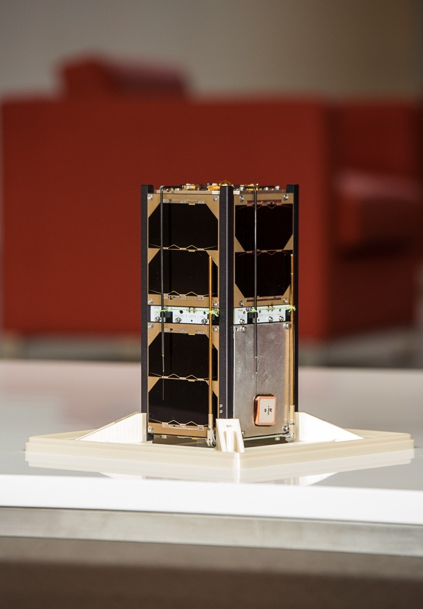 photo of a CubeSat sitting on a table