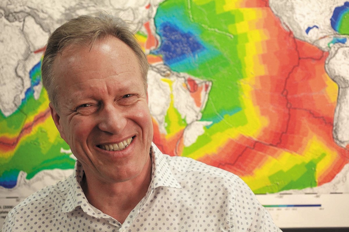 Professor Dietmar Muller with a geographical map in the background