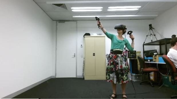 Professor of Computer Science Judy Kay playing a VR game.