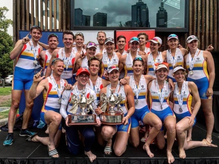 The men's and women's teams of the Sydney University Boat Club celebrating their dual victory