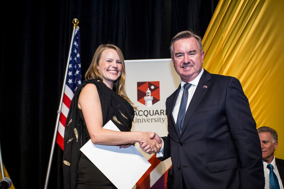 Lily accepts her NSW Postgraduate Scholarship from Chair of the Fulbright Commission Board of Directors, Peter de Cure