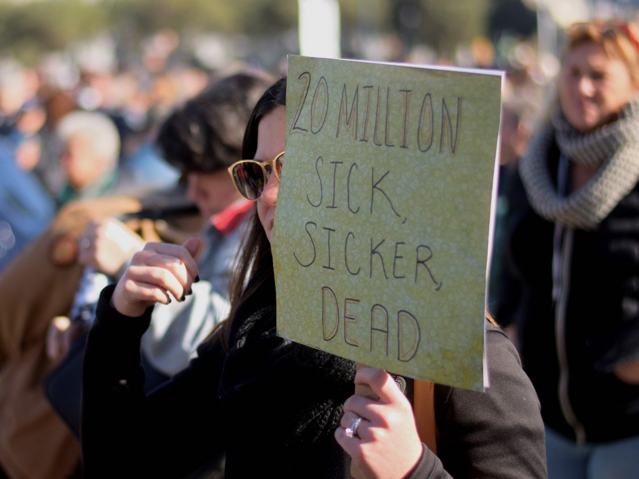 A demonstrator taking part in a protest against a proposed repeal of the Affordable Care Act in January 2017. Image: Tom Hilton/Wikimedia Commons.