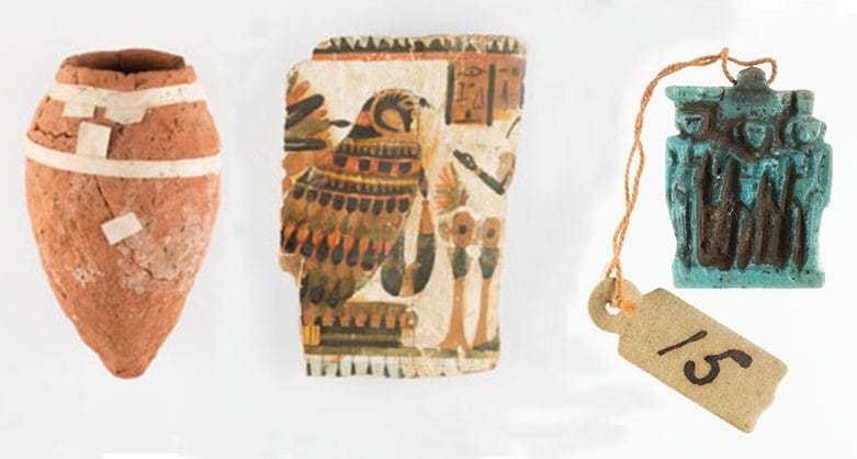 A ceramic jar, coffin fragment and amulet from the collection.