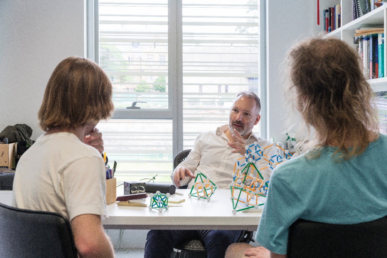 Professor Stephen Bartlett with students in the Quantum Theory Group.