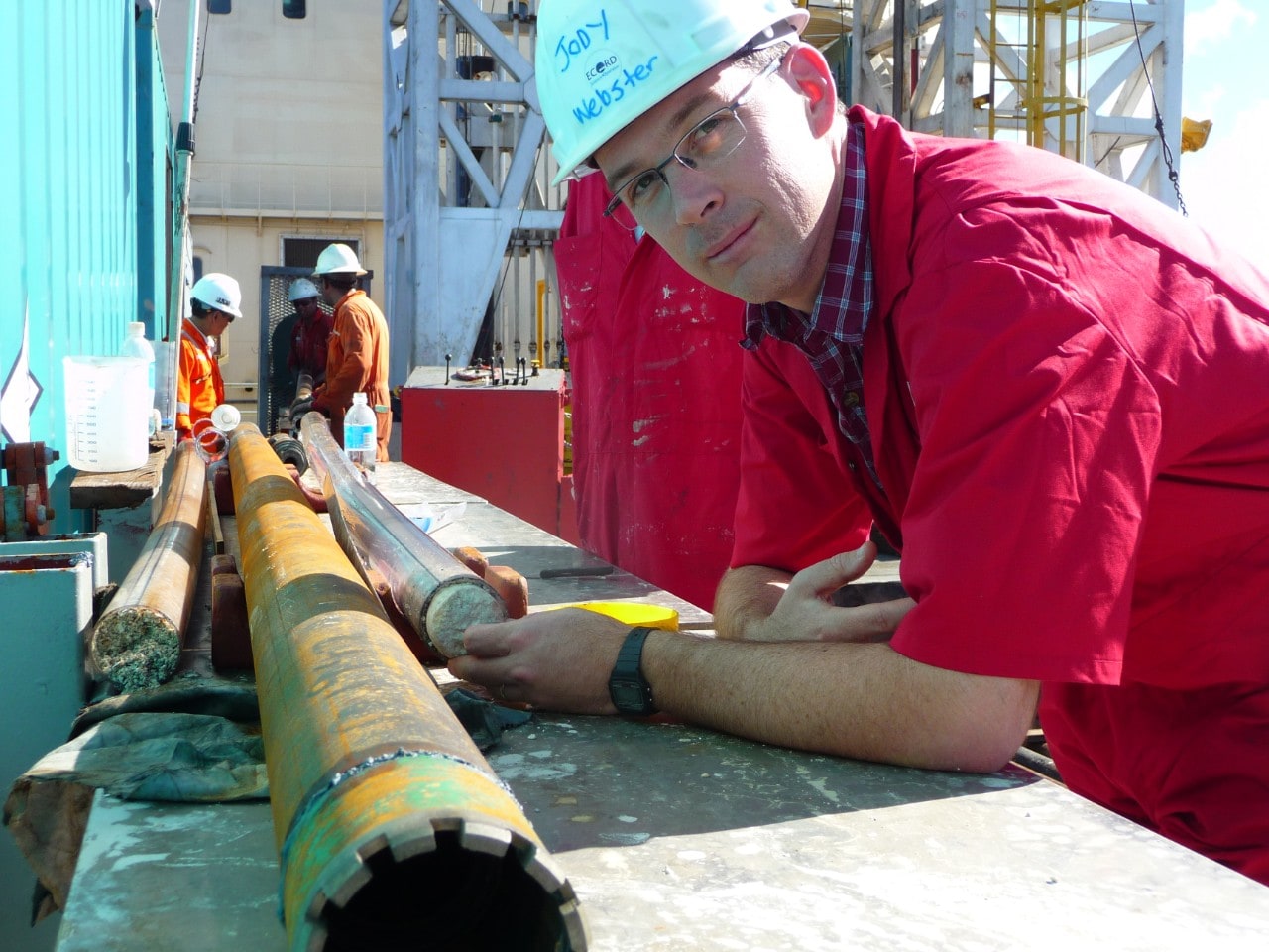 Associate Professor Jody Webster inspects a fossil reef core on board the Great Ship Maya. Photo: ECORD/IODP