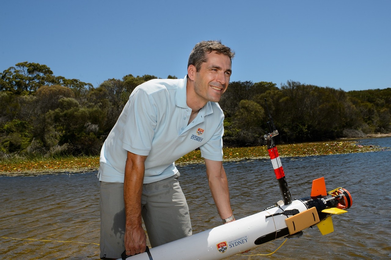 Professor Stefan Williams with an autonomous underwater vehicle