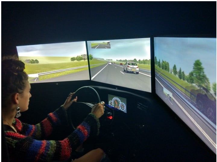 A person in a driving simulator doing a driving task