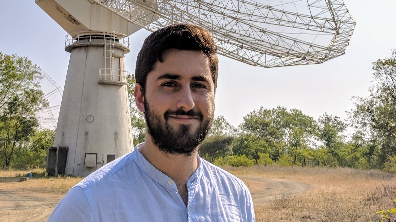 Lead author Andrew Zic at the GMRT radio telescope in India.