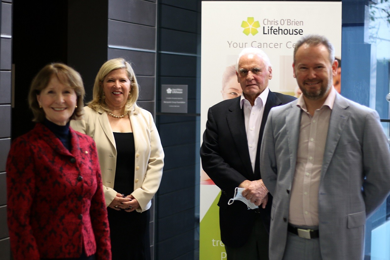 Gail O'Brien AO, Bronnie Taylor NSW Minister, Lang Walker AO and Professor Jonathan Clark AM at launch, standing in group in front of Chris O'Brien Lifehouse signage.