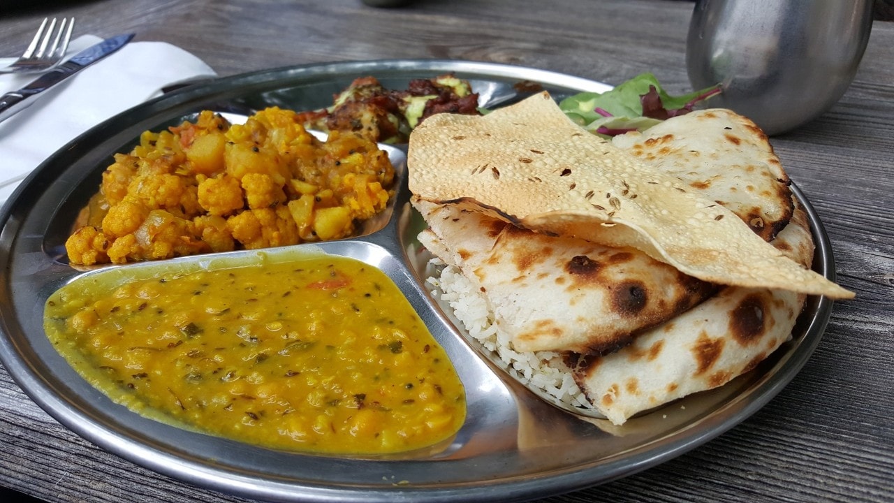 photo of an Indian meal of dahl and naan bread