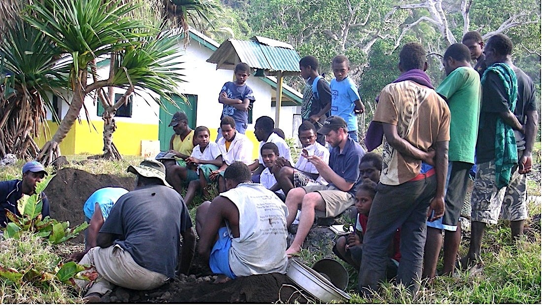 Dr James Flexner (centre) undertaking community-led research in Vanuatu.